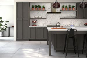 A Forevermark Cabinetry kitchen with gray cabinetry and marble counter tops.