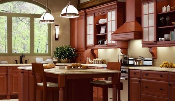 a wooden style kitchen interior design with marble dining table and wooden kitchen cabinets