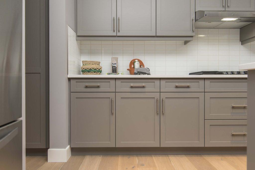 a simple kitchen interior design with gray wooden kitchen cabinets installed by mykitchencabinets