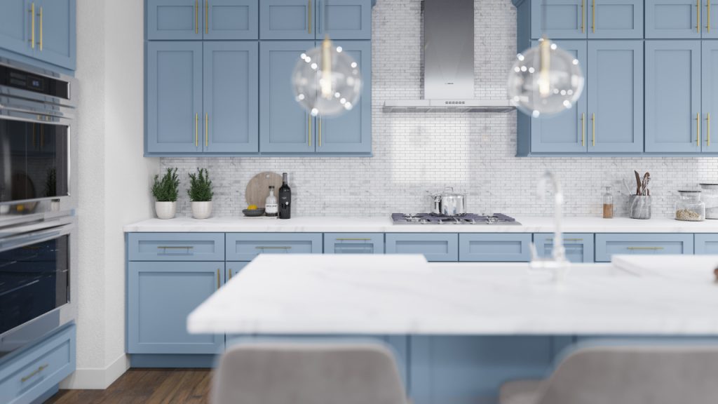 a white interior kitchen with marble island and blue wooden cabinets by forevermark cabinetry
