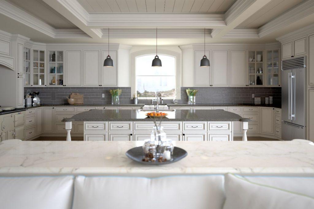a white kitchen interior with two marble islands and white wooden cabinets by mykitchencabinets